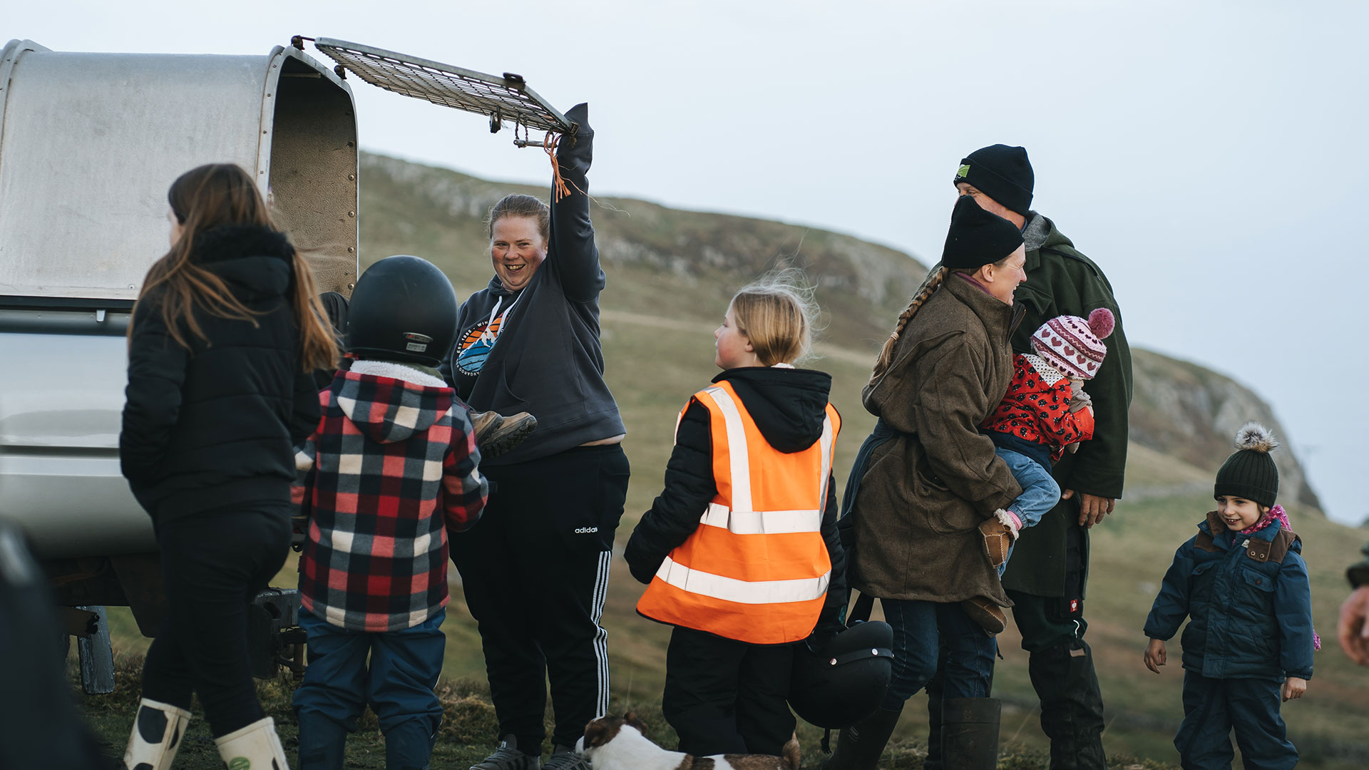 Taking a break from the gathering the Carneddau Ponies - a family with small children